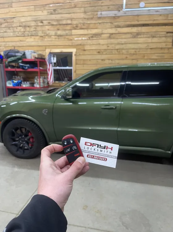 A new fob at a green Dodge Durango