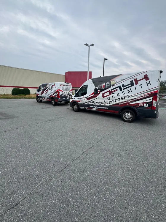 Two Onyx vans in a parking lot