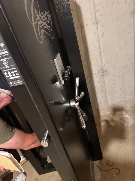 A gun safe standing open after an Onyx job