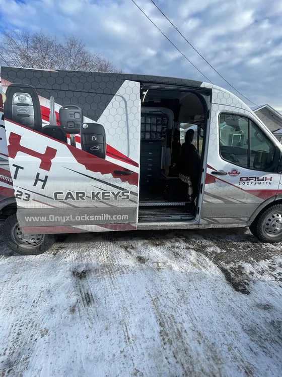 An Onyx van with its side door open, stocked for key cutting